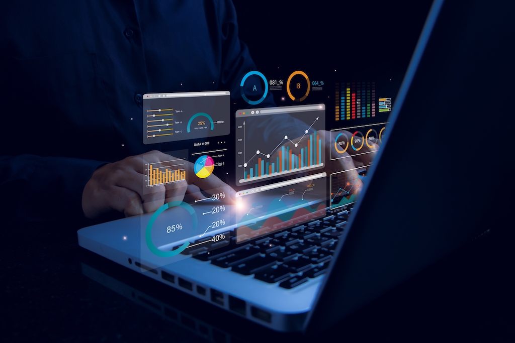 Data analytics with laptop, graphs and charts